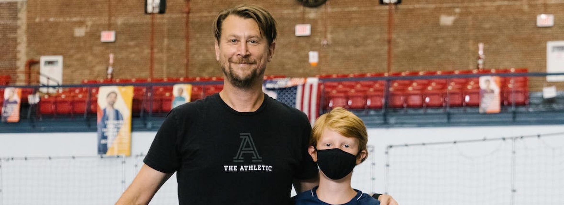 Father and son at the YMCA of Greater New York playing basketball and sports